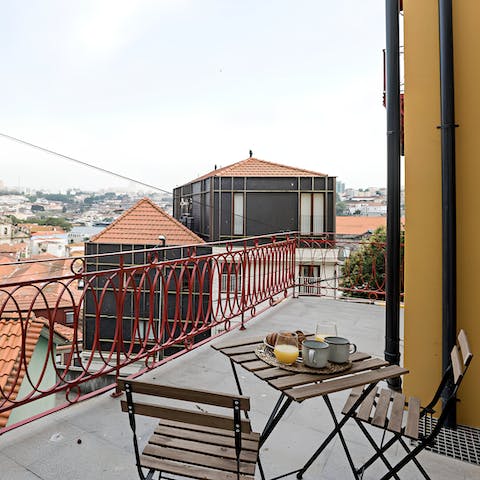 Breakfast on the private balcony overlooking the rooftops