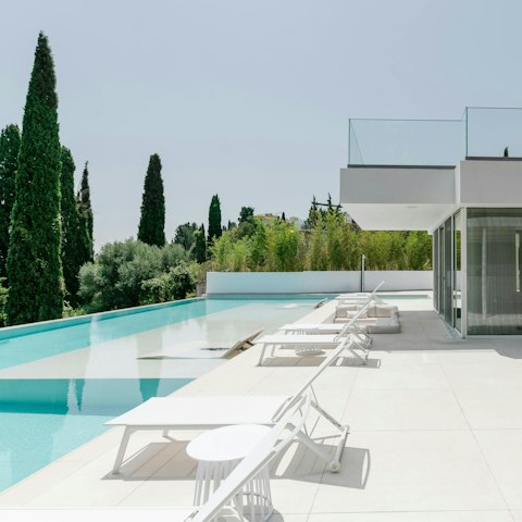 Relax on a lounger in the pool with a view of the sea