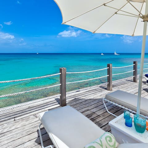 Soak up the sun overlooking the turquoise waters of the Caribbean Sea
