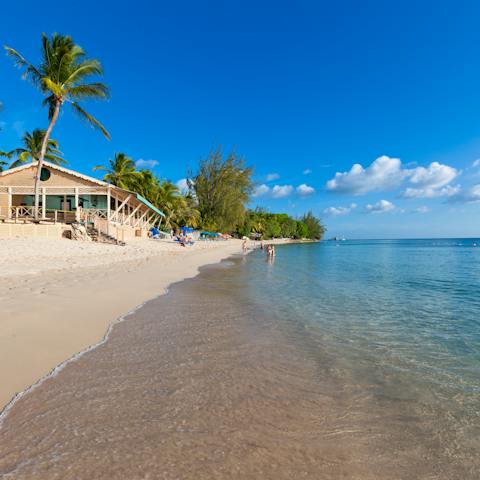 Step out onto the powdery white sands of Mullins Beach
