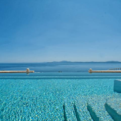 Take a dip in the private pool and admire the Aegean Sea