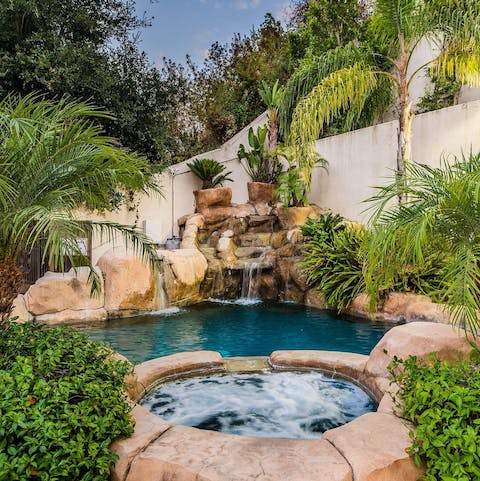 Unwind in the pool and jacuzzi hot tub