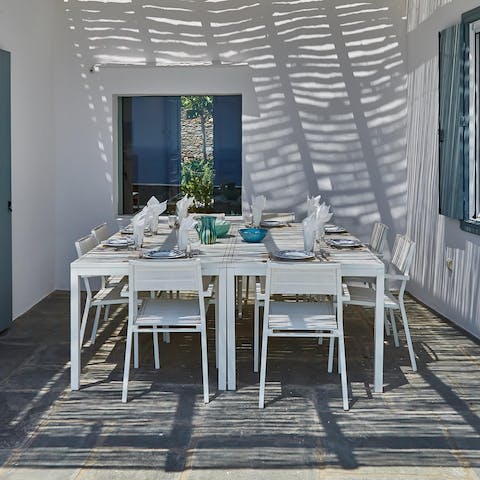 Wine and dine under the dappled sunlight of the pergola