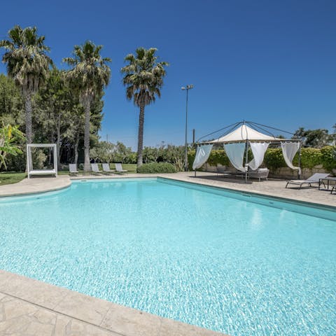 Relax amid the paradisal gardens, slipping past white curtains to jump in the pool