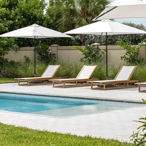 Spend lazy days stretched out by the pool