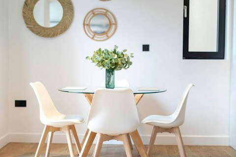 Gather around the glass table for long meals together