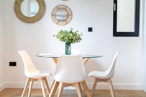 Gather around the glass table for long meals together