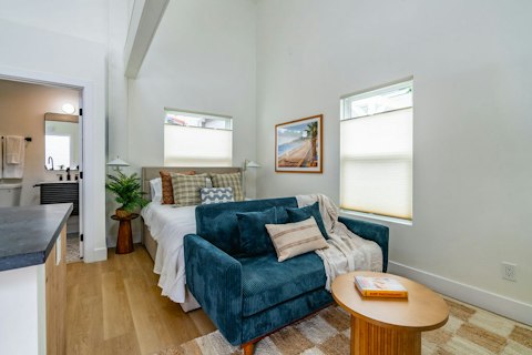 Cook, lounge, and sleep in one light-filled space