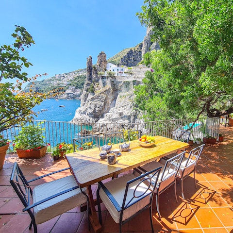 Dine alfresco with sweeping views across the bay