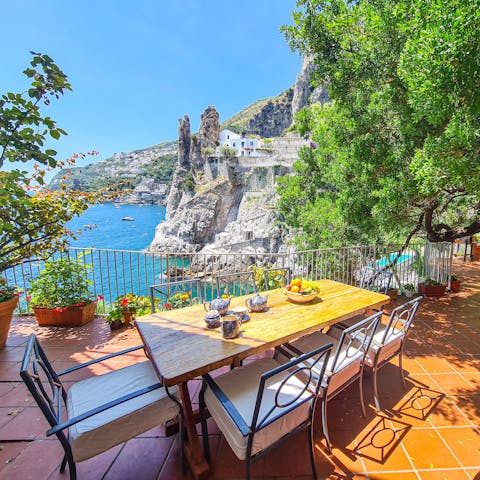 Dine alfresco with sweeping views across the bay