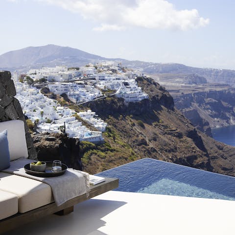 Be entranced by the views as you dip in the infinity pool