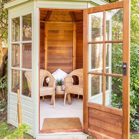 Enjoy views of the garden as you relax in the summer house