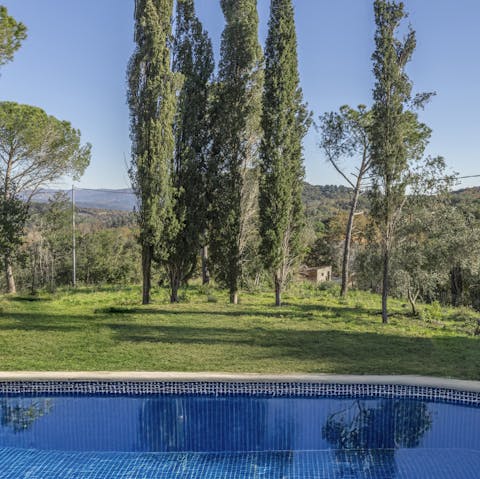 Take in the views from the shared pool of the Tuscan countryside