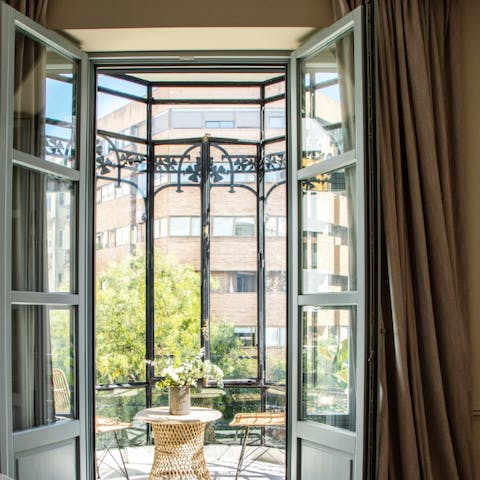 Watch a sunset over the city from this bright sunroom, with your dog on your lap