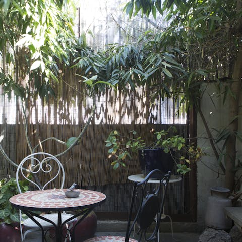 Sit outside in your private courtyard with a cup of coffee