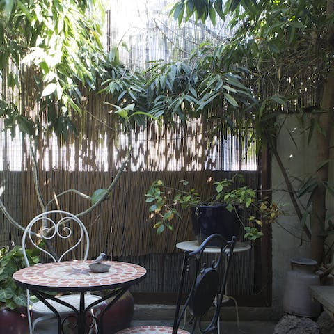 Sit outside in your private courtyard with a cup of coffee