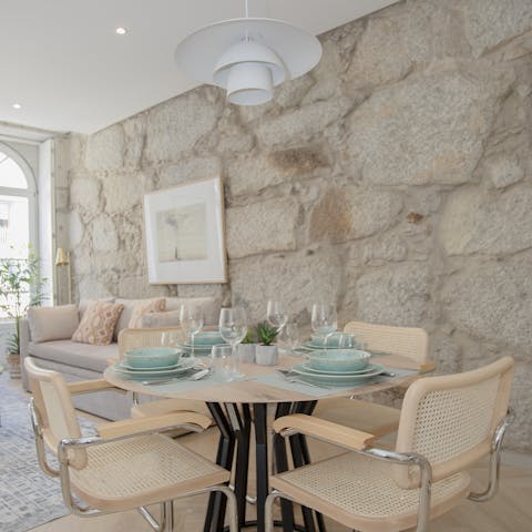 Gather for a group feast at the stylish dining table