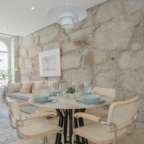 Gather for a group feast at the stylish dining table