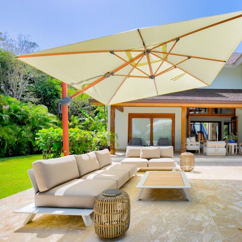 Flop down on the outdoor sofa with a good book and a cool drink