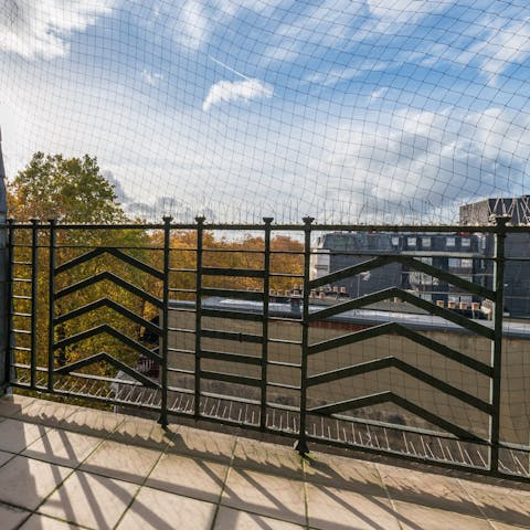 Watch parakeets flit through the treetops from your private balcony