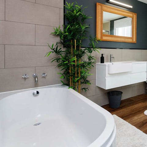 Sneak away for a long soak in the roll top bath