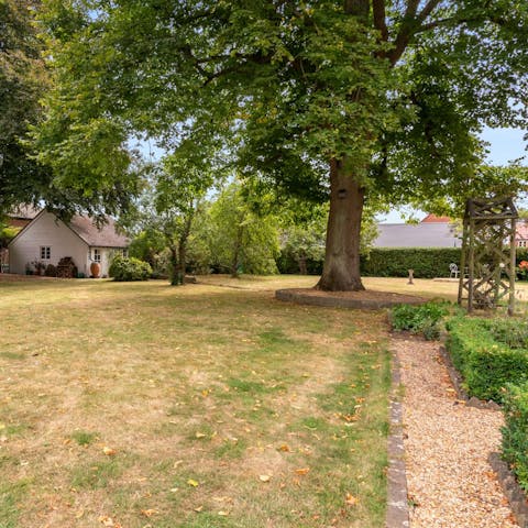 Wander about your extensive private garden four-legged friend in tow