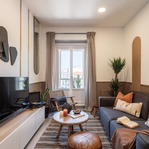 Relax in the stylish living area with a glass of Spanish wine while a record plays