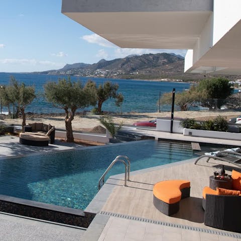 Take a dip in the sparkling swimming pool with views across the seascape