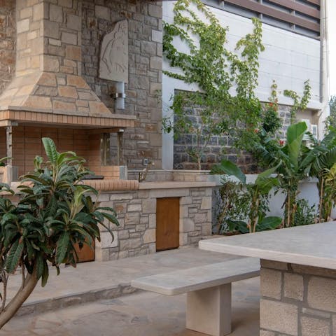 Fire up the barbecue at the outdoor kitchen setting