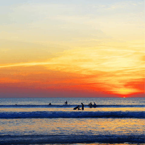 Watch the surfers at nearby Pantai Batu Belig beach