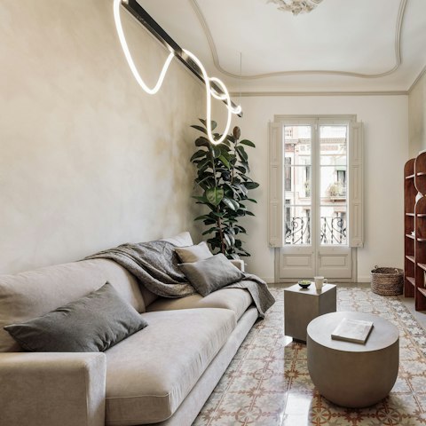 Sprawl out in the cosy living room after exploring Barcelona