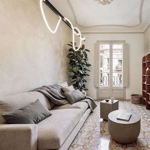 Sprawl out in the cosy living room after exploring Barcelona