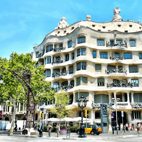 Check out the famous Casa Milá, fifteen minutes away
