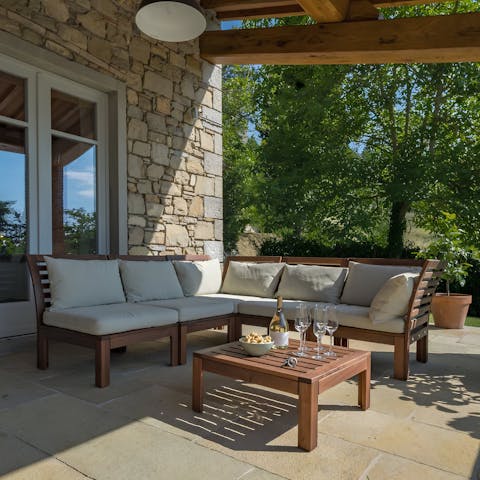Cosy up in the alfresco lounge on the covered terrace and enjoy the views