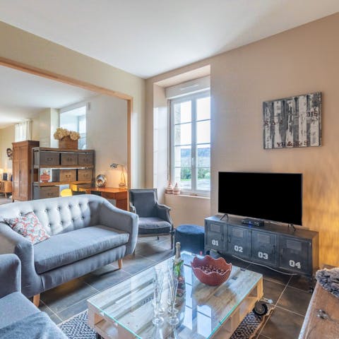 Relax in the snug living room after a day of discovering Caden