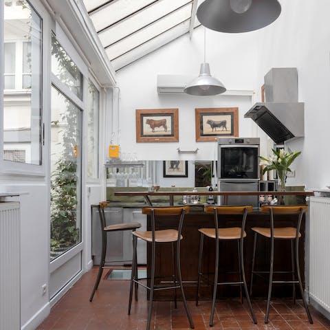 Rustle up meals in the conservatory-style kitchen