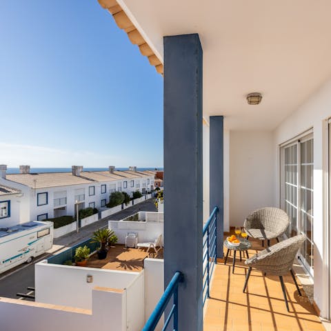 Watch the sunrise over the ocean and a savour a Portuguese café on the private balcony