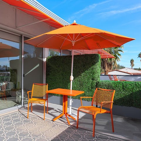 Enjoy breakfast on the patio with mountain views