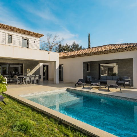 Begin your day in the serene garden with a refreshing dip in the pool