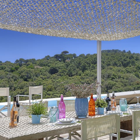Enjoy alfresco meals under this cute covered dining spot