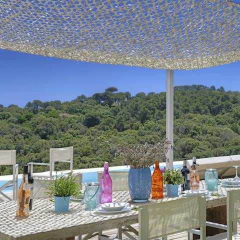Enjoy alfresco meals under this cute covered dining spot