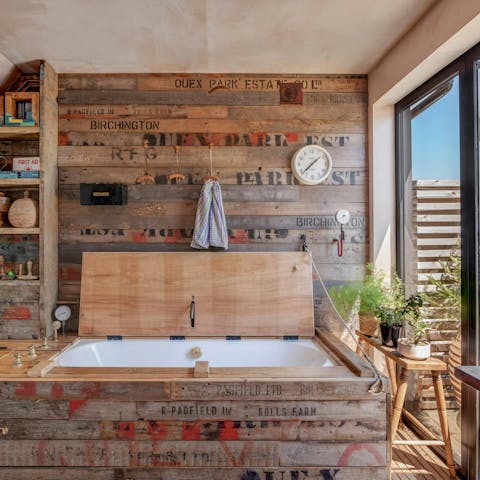 Fill the hidden bathtub with bubbles and soak your cares away