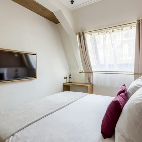 Enjoy a film in bed after a long day of sightseeing