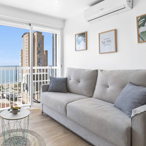 Get cosy in the light-filled and comfy living room