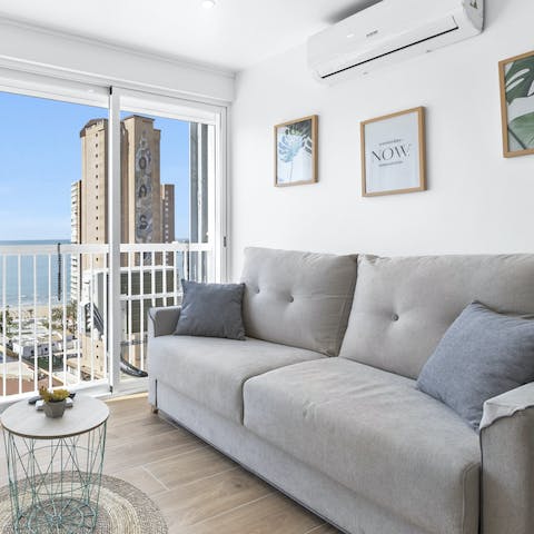 Get cosy in the light-filled and comfy living room