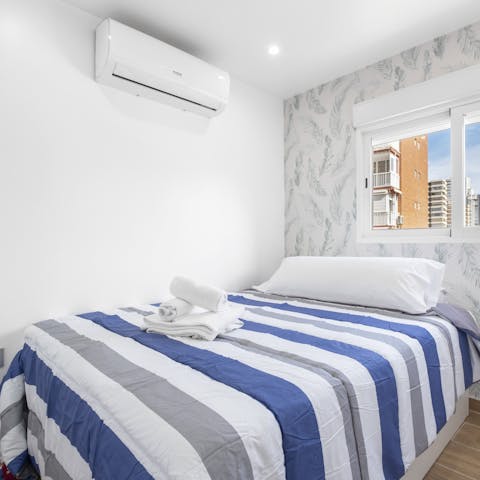 Wake up well-rested in the comfy bedrooms and get ready for another sunny beach day