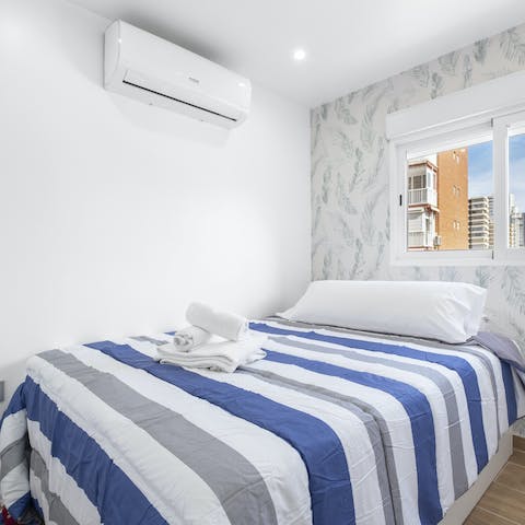 Wake up well-rested in the comfy bedrooms and get ready for another sunny beach day