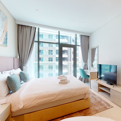 Watch TV from the comfort of the king-size bed