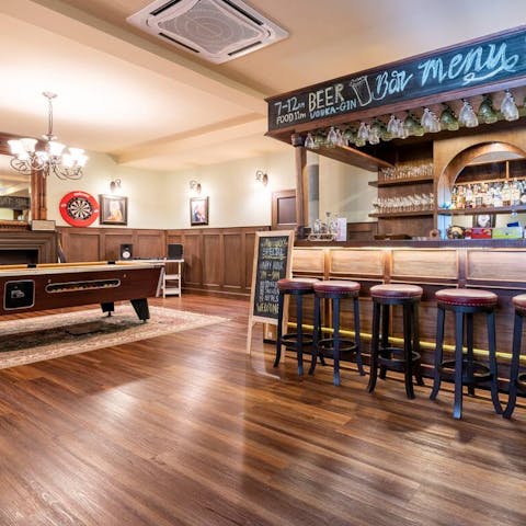Relax with your friends enjoying drinks and games in your private bar