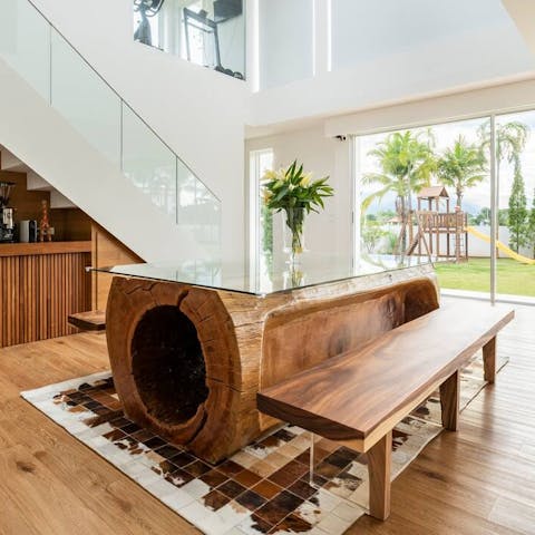 Share delicious meals at the unique wooden dining table